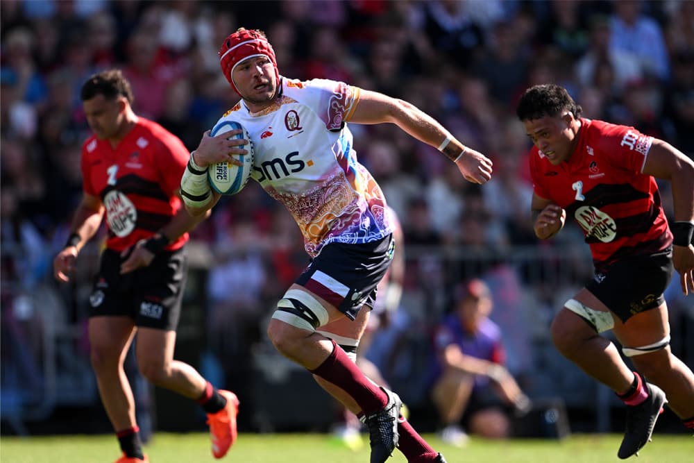 Reds No.8 Harry Wilson dashes into open space against the Crusaders in Christchurch